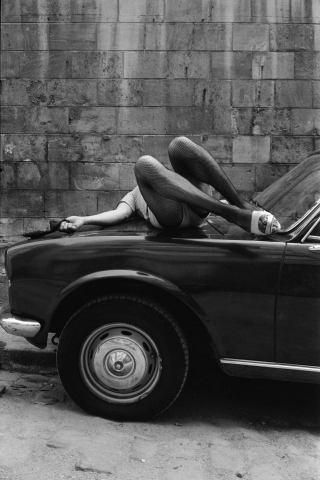 Blondine dances in the hallway. La Rue des Lombards, Paris, France, 1976-1977 © Jane Evelyn Atwood