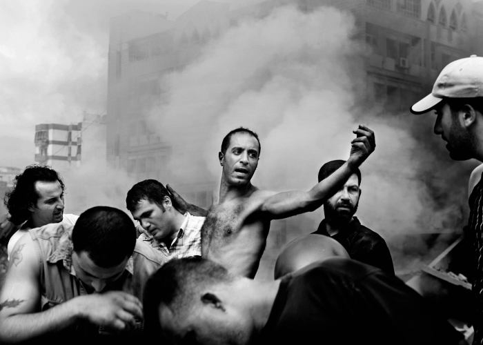 ©Paolo Pellegrin ©Magnum Photos, Civilians dig through debris for survivors just moments after an Israeli air strike destroyed several buildings in Dahia, Beirut, Lebanon, 2006© Paolo Pellegrin